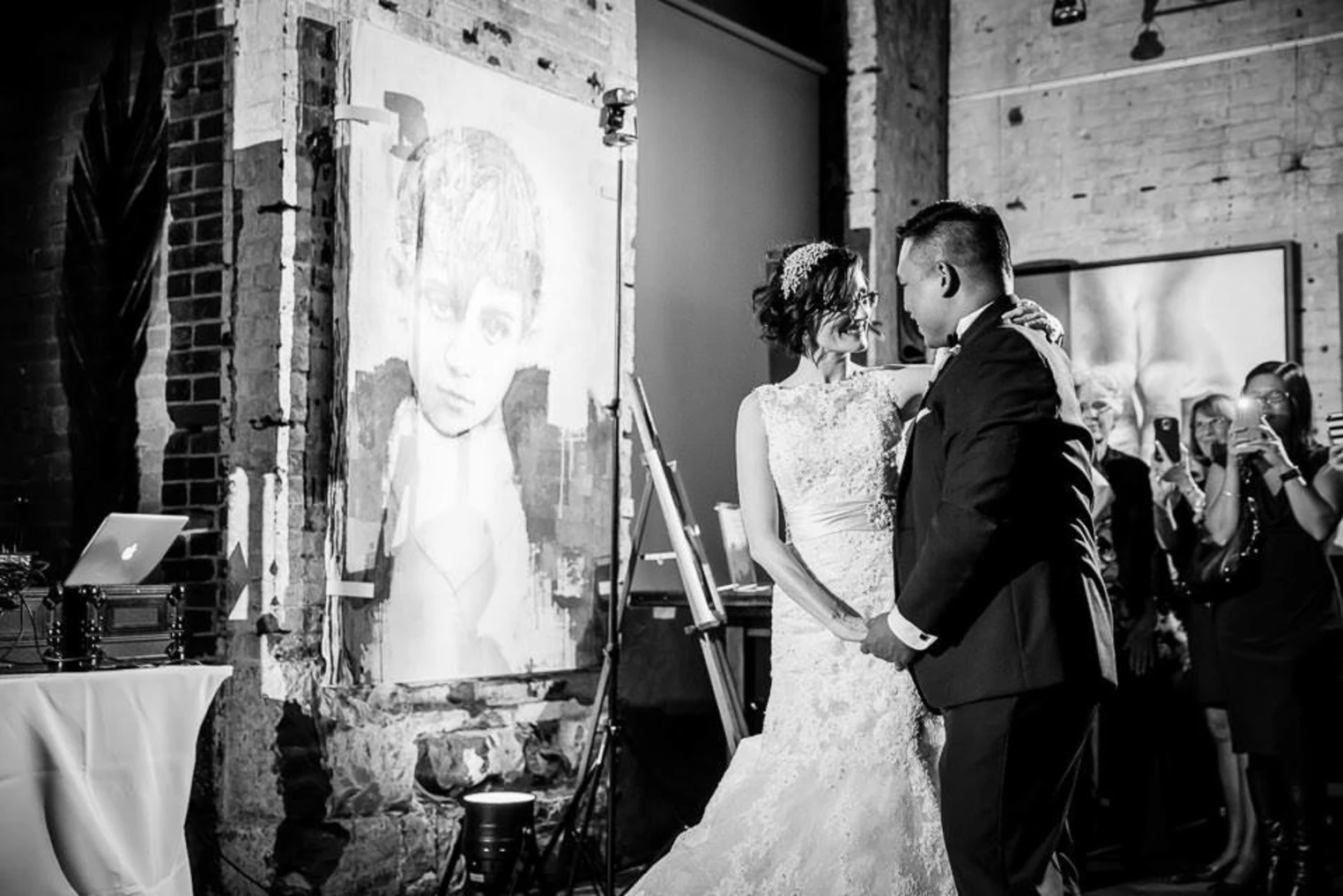 A couple dancing in wedding attire
