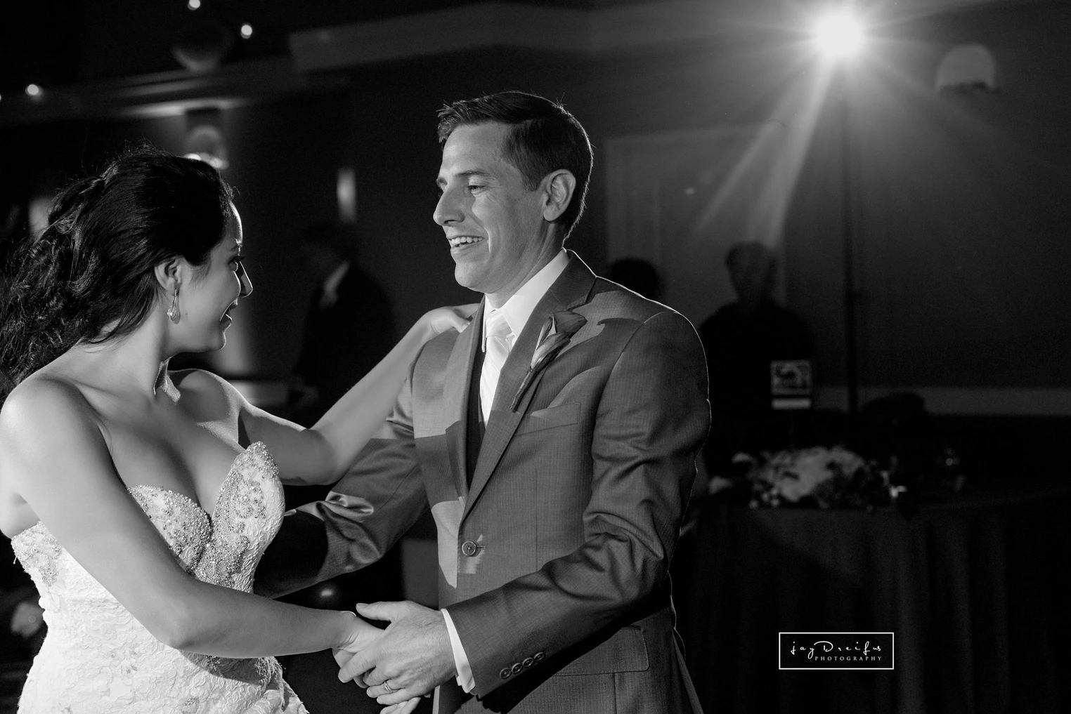 A couple dancing in wedding attire