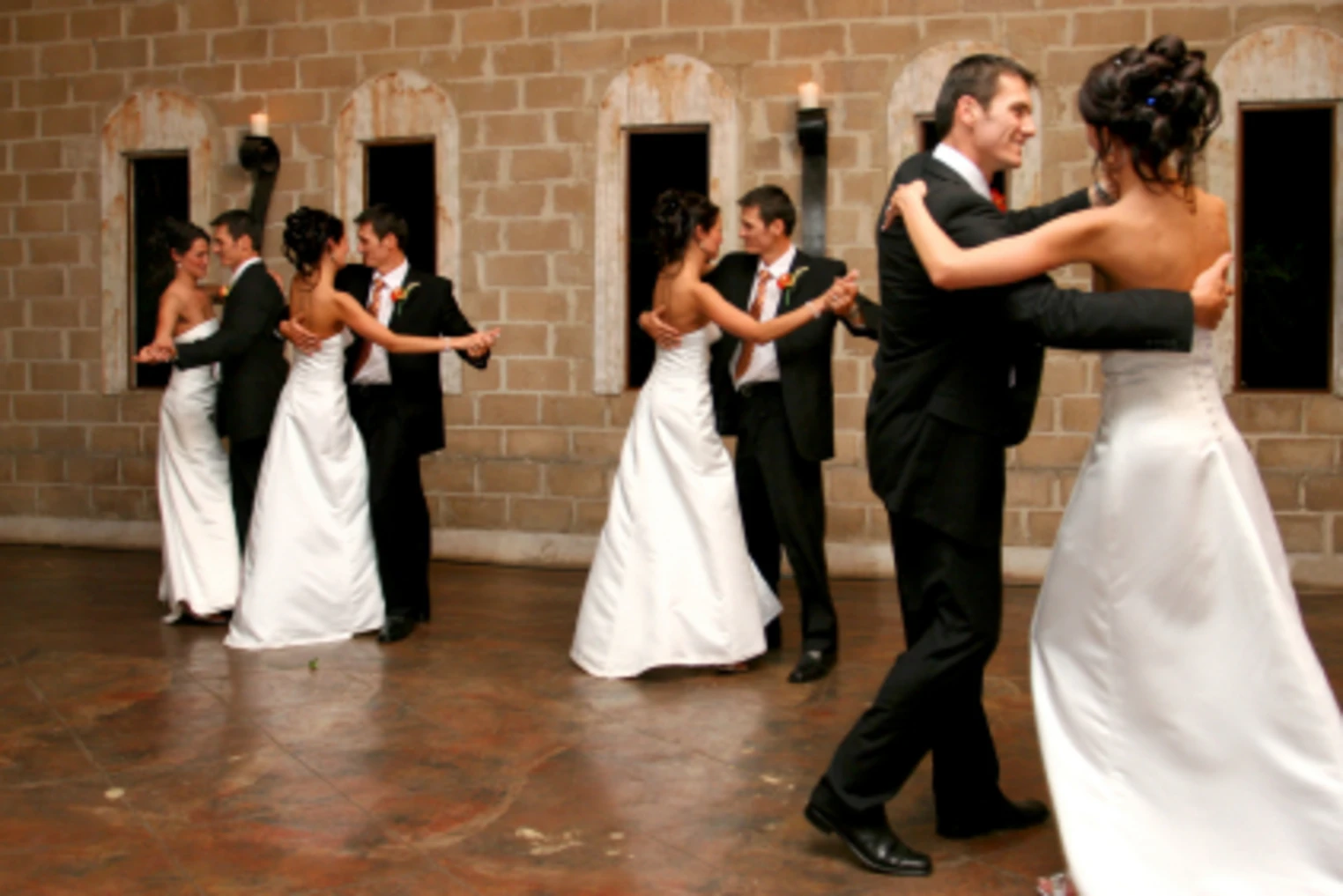 A photo showing the same couple in wedding attire at different points of their dance