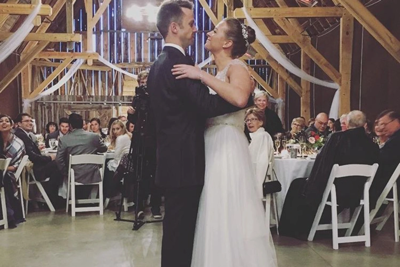 A couple dancing in wedding attire