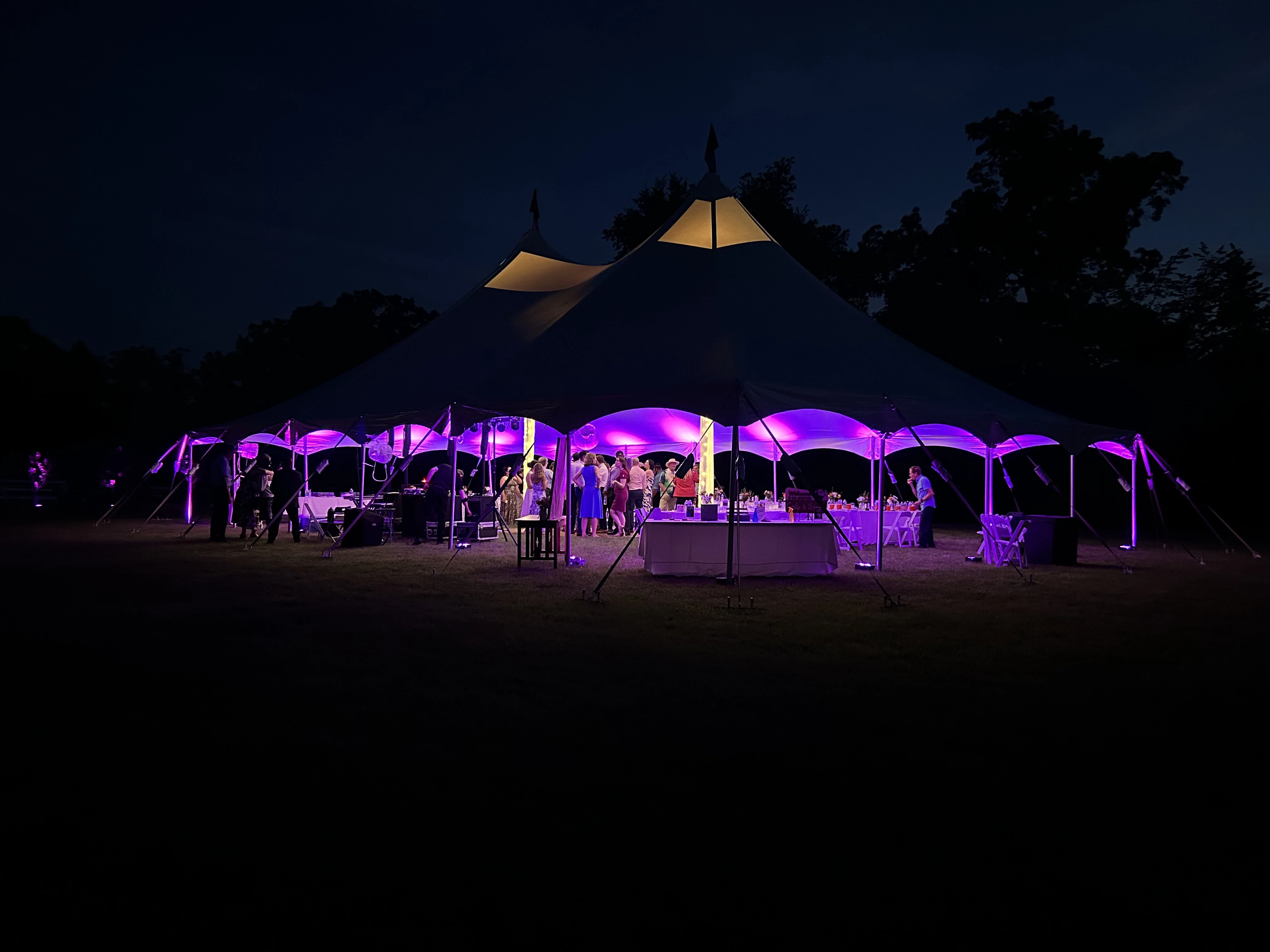 Dorian's up lighting setup at an outdoor venue under a tent